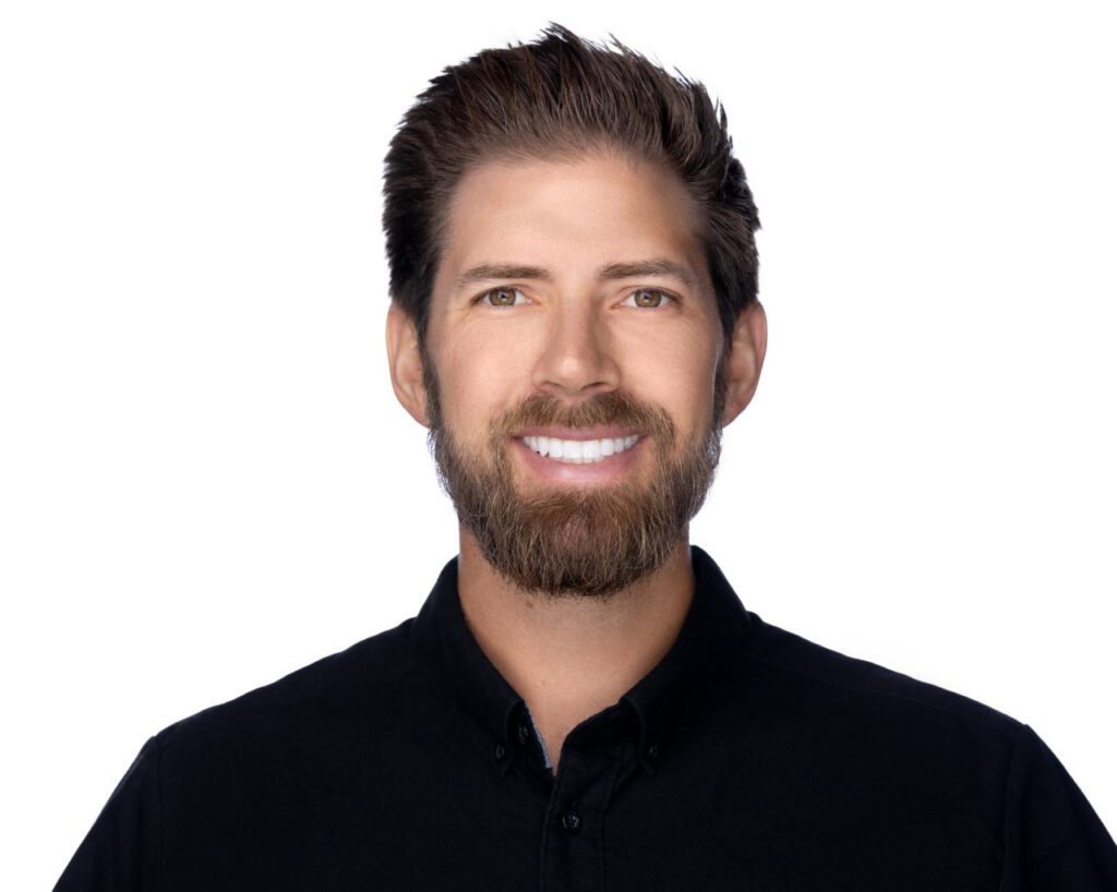 A man with a beard and a black shirt offering a higher standard for orthodontic treatment in Salinas.